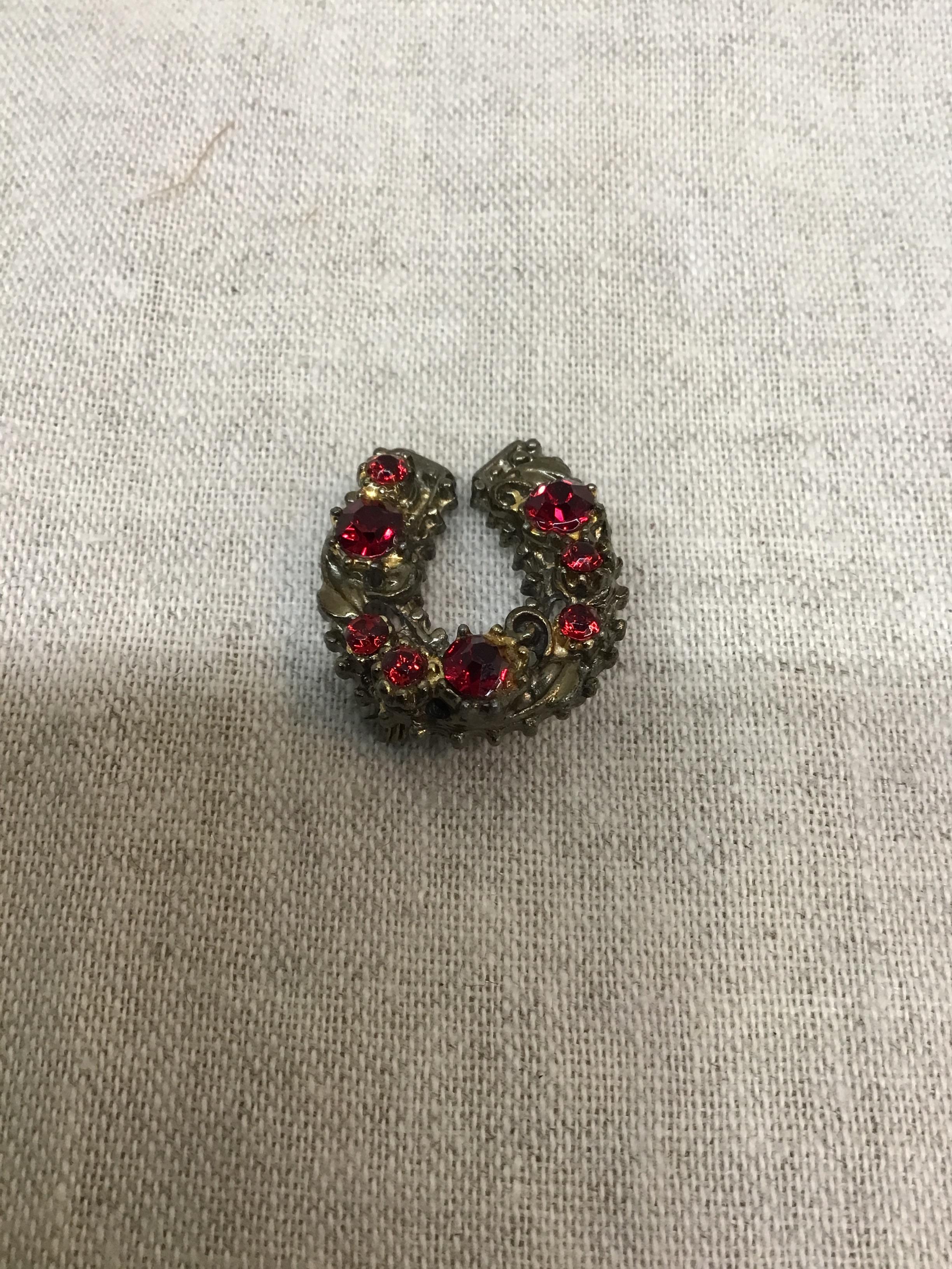Horseshoe Brooch with red gemstones