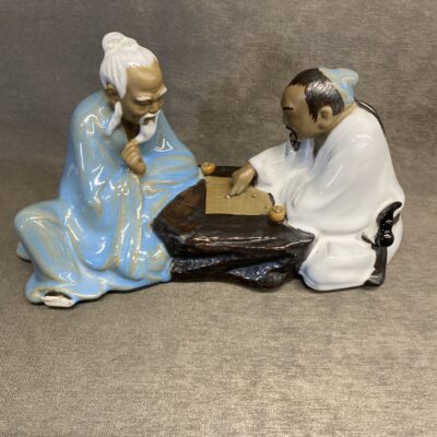 Chinese Mudman Playing Go